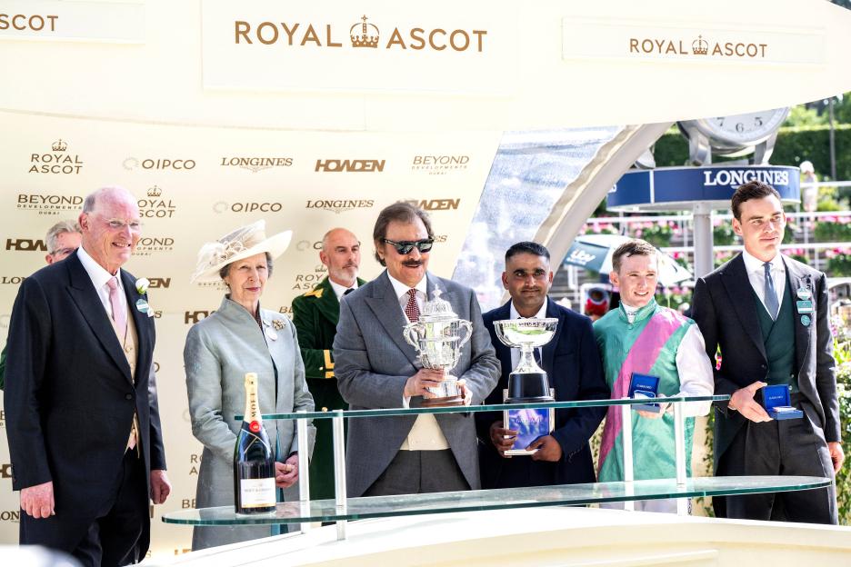 Princess Anne and others holding trophies at Royal Ascot.