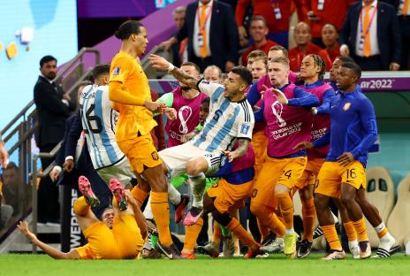 Leandro Paredes of Argentina clashing with Netherlands players.