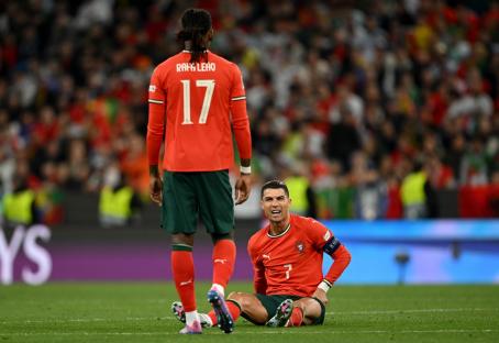 MUNICH, GERMANY - JUNE 08: Cristiano Ronaldo of Portugal reacts following an injury during the UEFA Nations League 2025 final match between Portugal and Spain at Munich Football Arena on June 08, 2025 in Munich, Germany. (Photo by Sebastian Widmann - UEFA/UEFA via Getty Images)