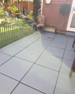 Grey patio painted to look new.