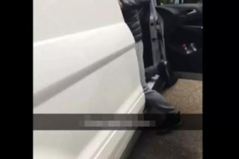 Person exiting a van.