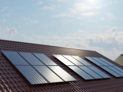 Illustration of solar panels on a house roof.