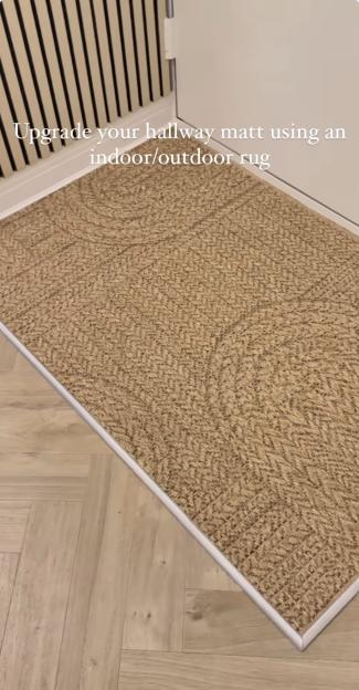 Indoor/outdoor rug replacing hallway mat.