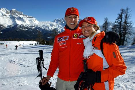 Michael Schumacher and his wife Corinna skiing in the mountains.