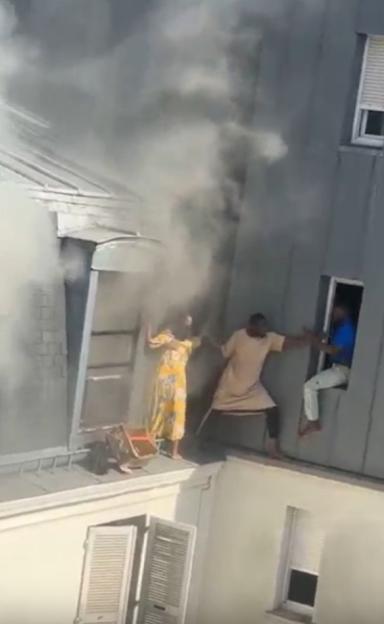 People escaping a building fire.