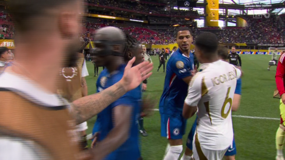 Soccer players interacting on the field.