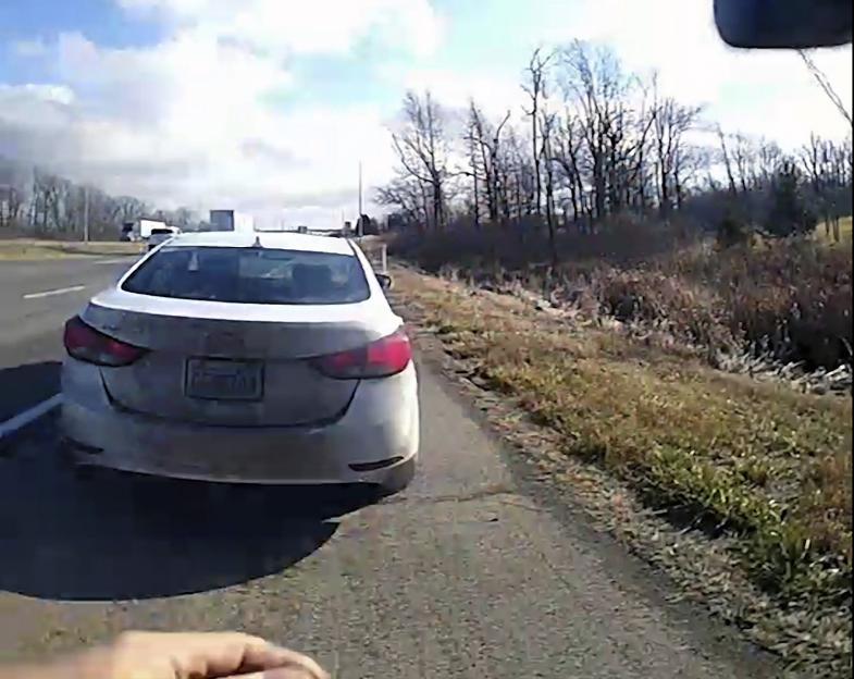 Bodycam image of a white Hyundai Elantra during a traffic stop.