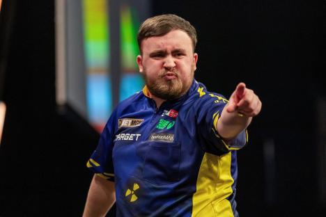 Luke Littler celebrates winning a leg at the BetMGM Premier League Darts.