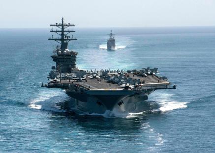 USS Nimitz aircraft carrier and other US Navy ships at sea.