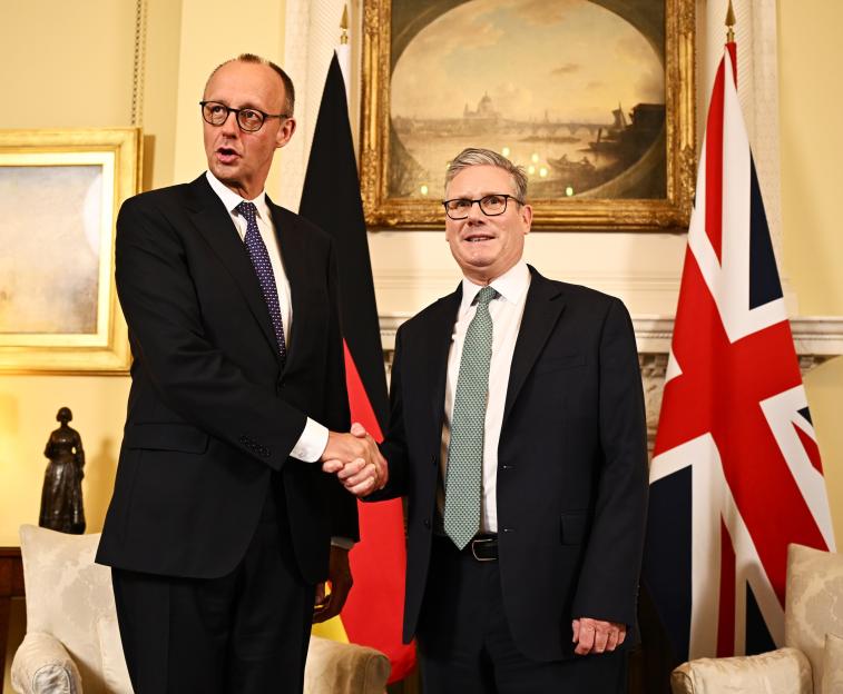 Keir Starmer and Friedrich Merz shaking hands in Downing Street.