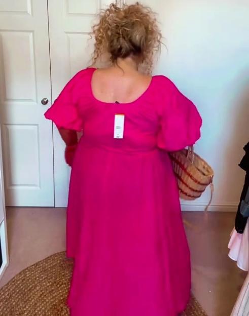 Woman in a pink dress.