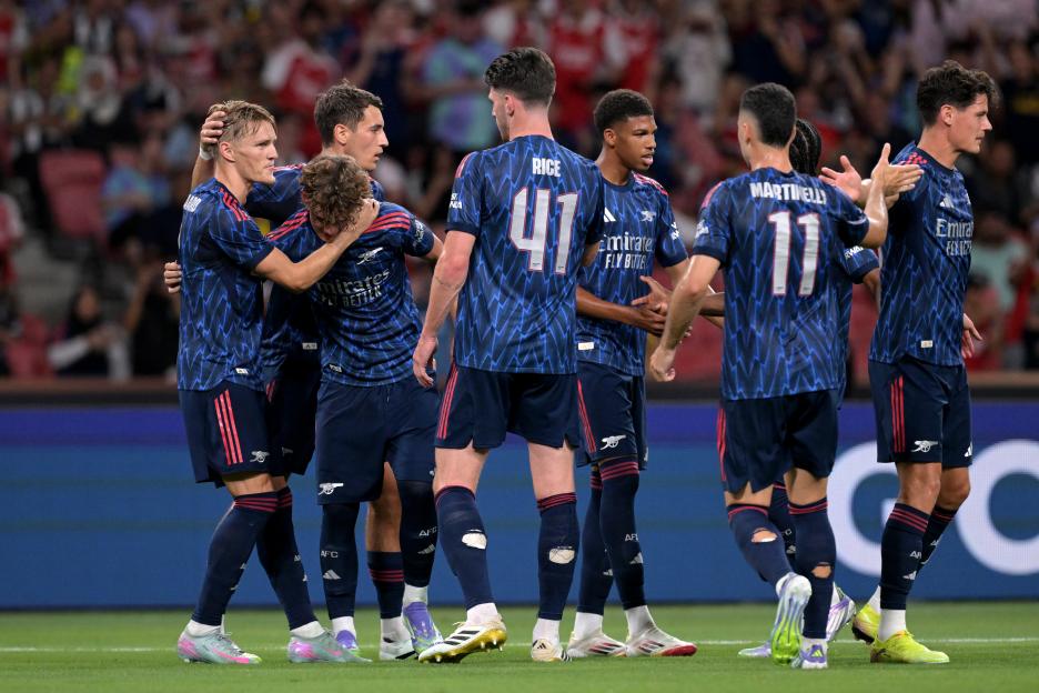 Arsenal players celebrating a goal.