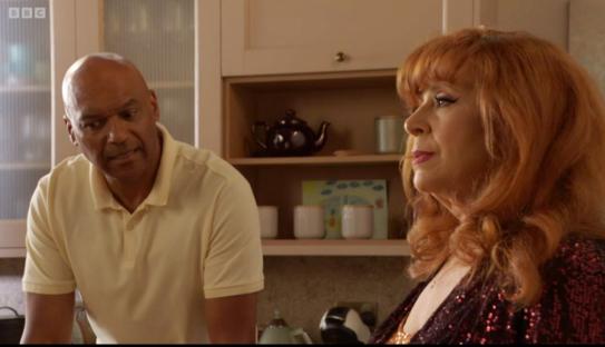 Screenshot of George Knight and Elaine from EastEnders in a tense kitchen scene.