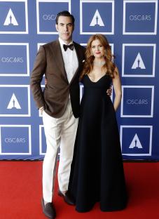 Sacha Baron Cohen and Isla Fisher at an Oscars screening.
