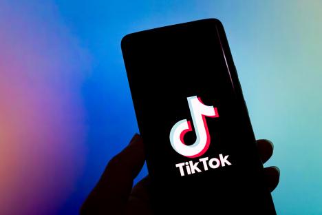 TikTok logo displayed on a smartphone.