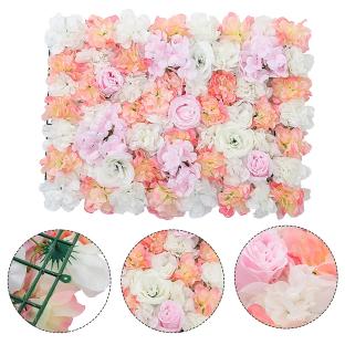 Artificial flower wall panel in pink and white.