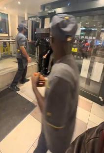 A McDonald's employee slapping a customer during an altercation.
