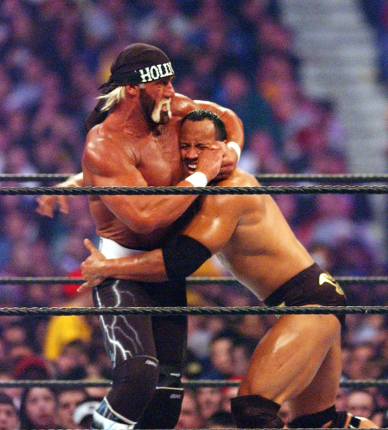 Hulk Hogan wrestling The Rock.