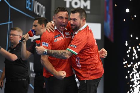 Gerwyn Price and Jonny Clayton celebrating a darts victory.