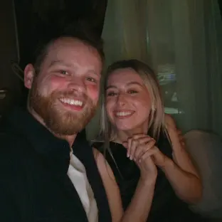 A couple smiling together.