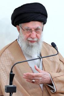 Ali Khamenei speaking at a microphone.