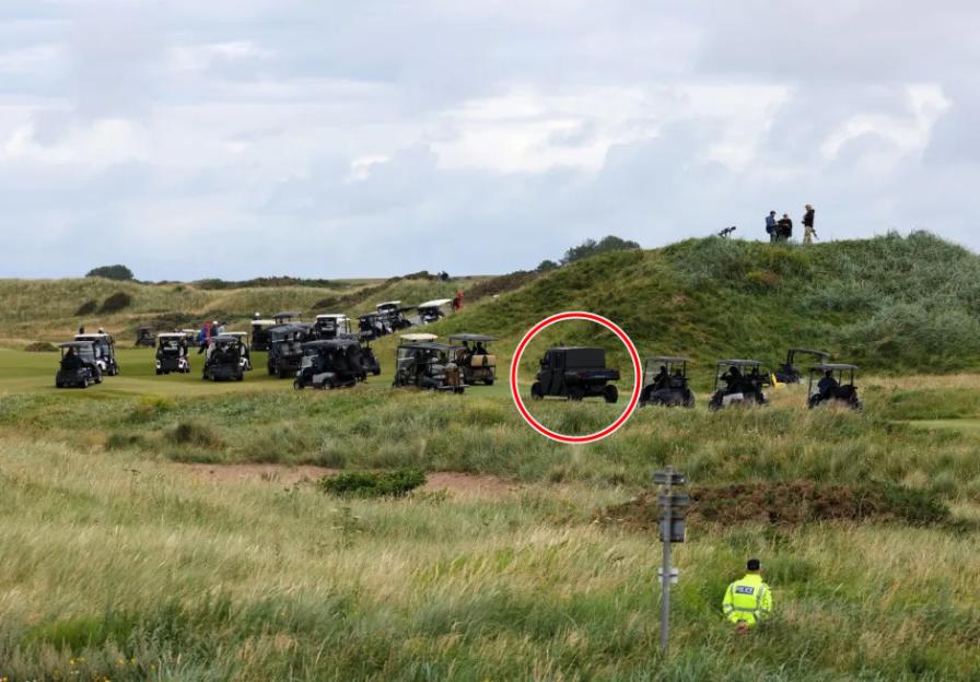 Golf carts and a security vehicle on a golf course.