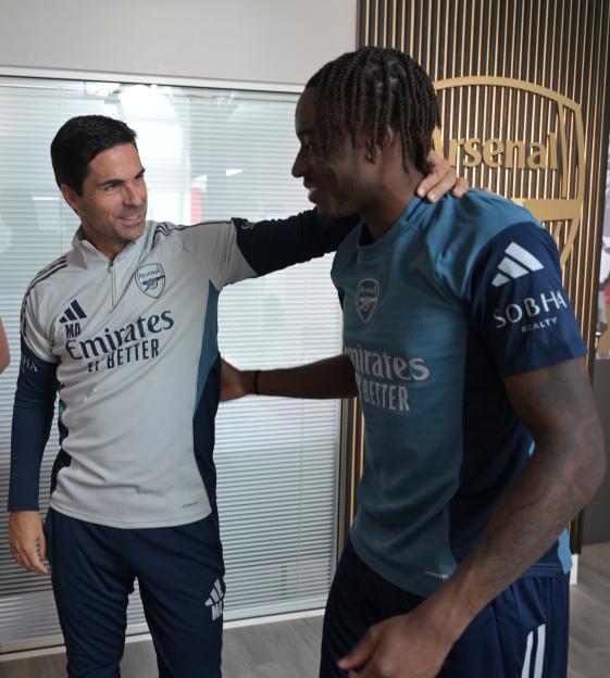 Arsenal manager Mikel Arteta with new signing Noni Madueke.