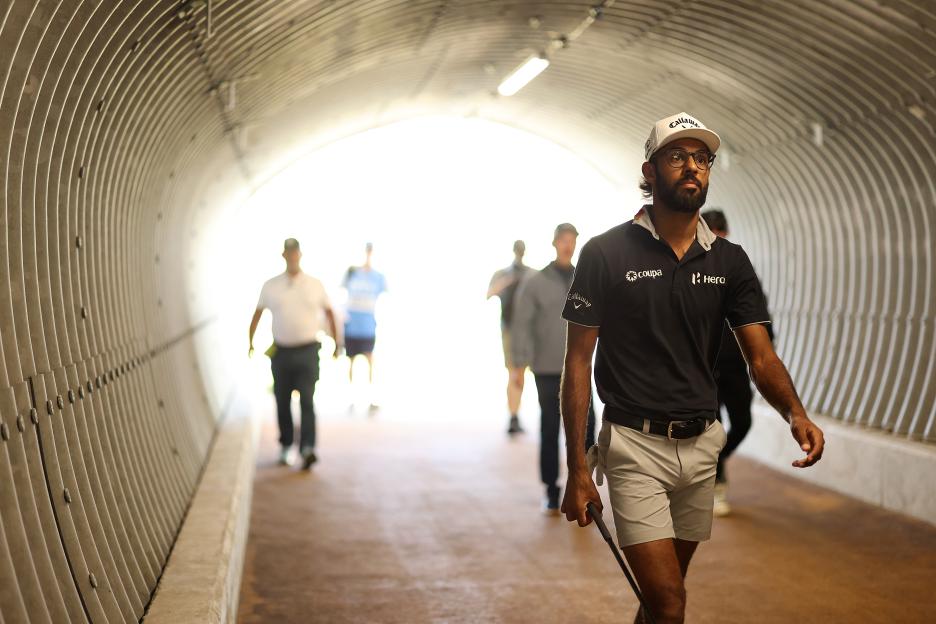 Akshay Bhatia walking through a tunnel.