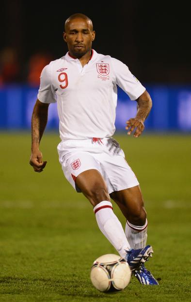 Jermain Defoe of England playing soccer.
