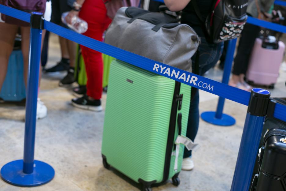 Ryanair.com branded queue barrier at an airport.
