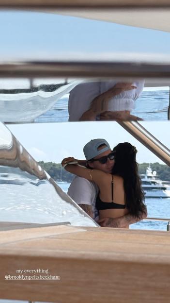 Couple hugging on a boat.
