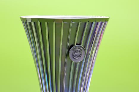 Close-up of the UEFA Conference League trophy.