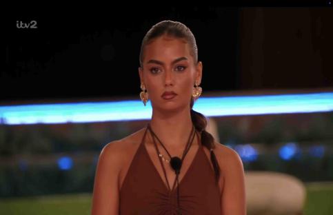 Shakira from Love Island at the fire pit.