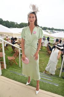 Ferne McCann at Royal Ascot wearing a light green dress and fascinator.