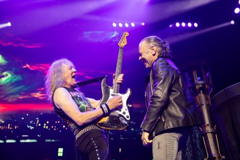 Janick Gers and Bruce Dickinson of Iron Maiden performing live on stage.