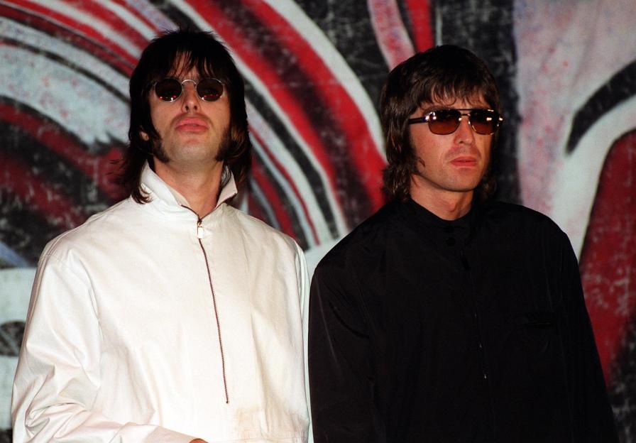 Liam and Noel Gallagher of Oasis at a press conference.