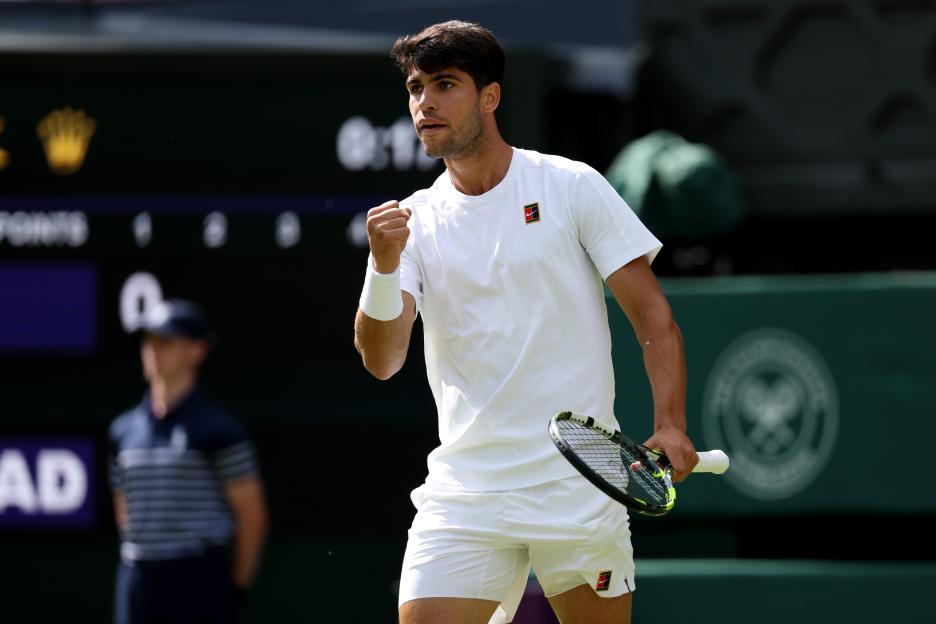 Carlos Alcaraz of Spain celebrates winning a point at Wimbledon.