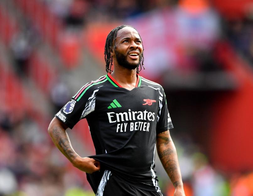 Raheem Sterling of Arsenal in a black and white jersey.