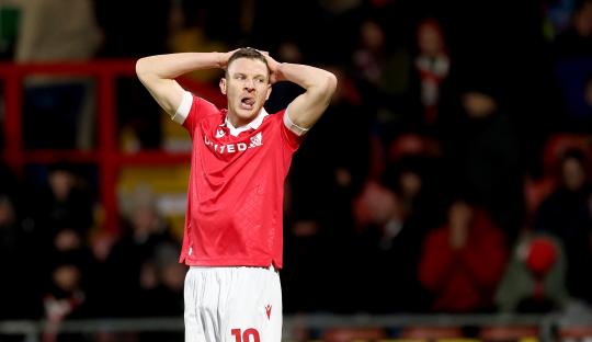 Paul Mullin of Wrexham AFC reacting during a soccer match.