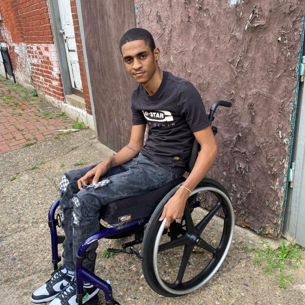 Young man in wheelchair.
