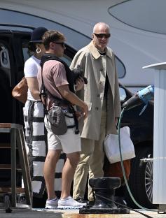 Daniel Day-Lewis and Rebecca Miller arriving by van and boarding a speedboat.