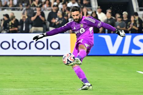 Hugo Lloris kicking a soccer ball.