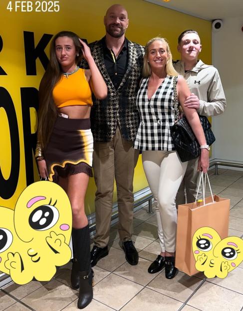 Paris Fury poses with her husband Tyson and two of their children.