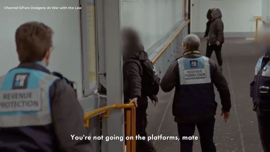 Screenshot of revenue protection officers preventing someone from accessing train platforms.