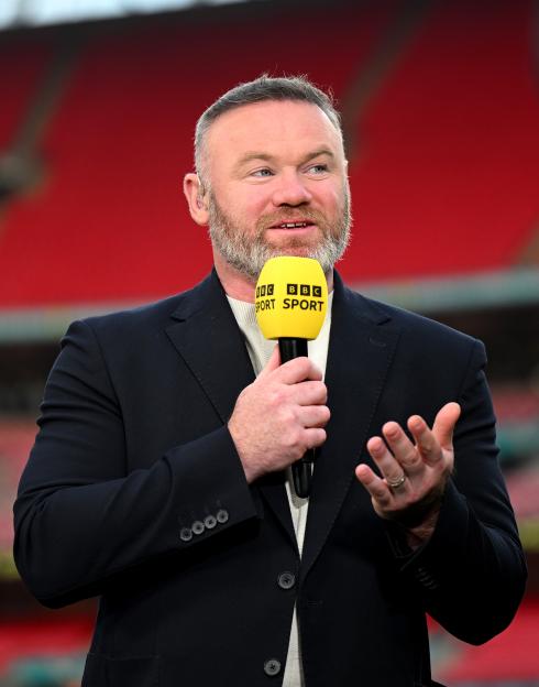 Wayne Rooney holding a BBC Sport microphone.