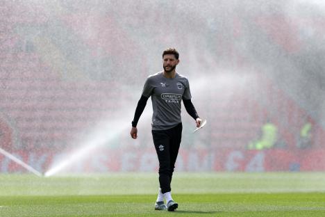 Adam Lallana, assistant manager of Southampton F.C., inspecting the pitch.