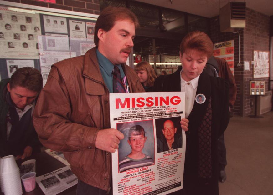 (Left to right) Jake and Monica Bourget show one of the posters that has been made and will be put on the back of trucks travelling nationwide in hopes of finding Jessyca Mullenberg who has been missing since September 16th and is believed to have been abducted from Eau Claire, Wi. by a neighbor, Steven Oliver. Jessyca is the 13-year-old daughter of Monica Bourget. Jake Bourget is Monica's stepdad. Friends, family and volunteers caravaned to Sam's Club in Fridley for a news conference about the missing girl. Behind the couple is a missing children display at Sam's Club.(Photo By JOEY MCLEISTER/Star Tribune via Getty Images)