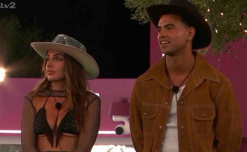 Two contestants on Love Island wearing cowboy hats.
