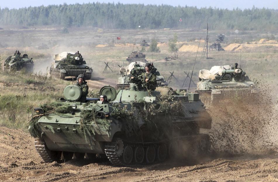 Belarusian army vehicles driving during war games.