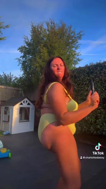 Woman in yellow bikini shows off post-baby body while promoting tanning product.